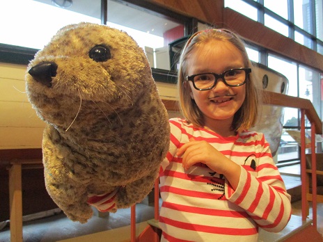 Young girl with seal puppet