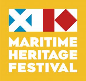 A yellow sign with white Maritime Heritage Festival