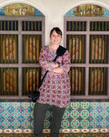A person standing in front of a windowAI-generated content may be incorrect.