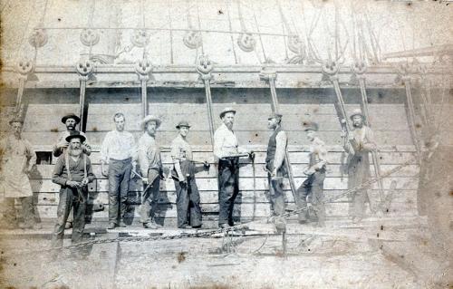 MP300.3.1: Caulkers at work at the Ebenezer Cox Shipyard, Kingsport, NS, around 1890.