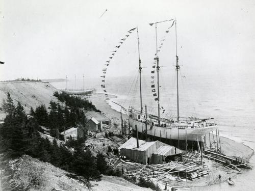 MP9.229.1: Tern schooner Irma Bentley under construction at Elderkin shipyard, Port Greville, NS, 1908, with two unidentified vessels in background.