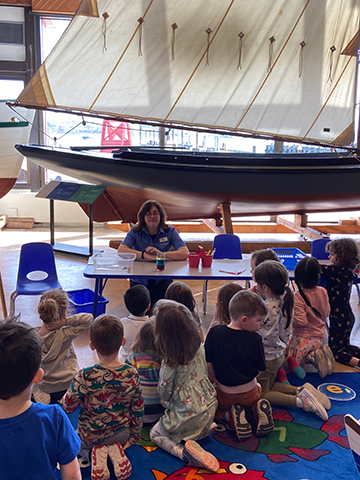 Welcome Wednesday at the Maritime Museum of the Atlantic, small children gather in front of museum staff.