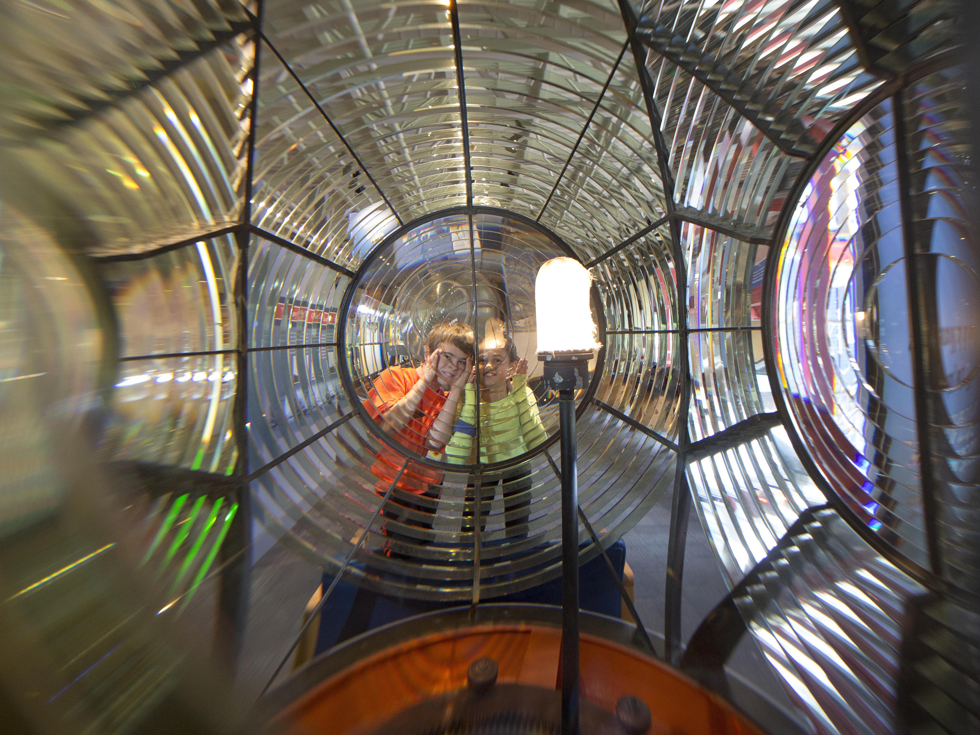 Two children looking through the Sambro lens