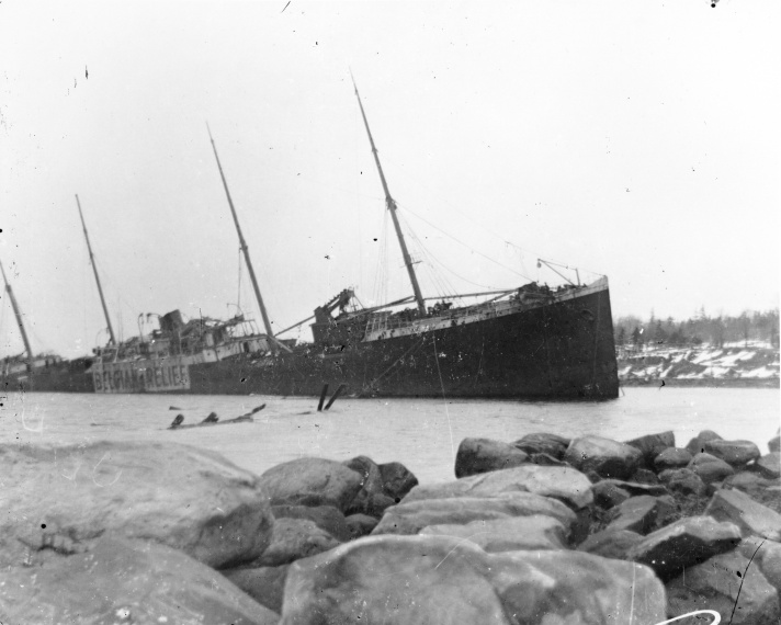 Imo aground and under guard on the Dartmouth shore