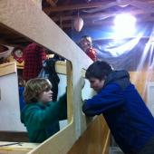 Local boy Scouts lend a hand sanding off some rough edges
