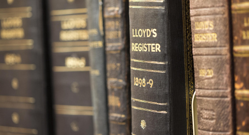 Shelf in library with copies of Lloyd's Registers. 