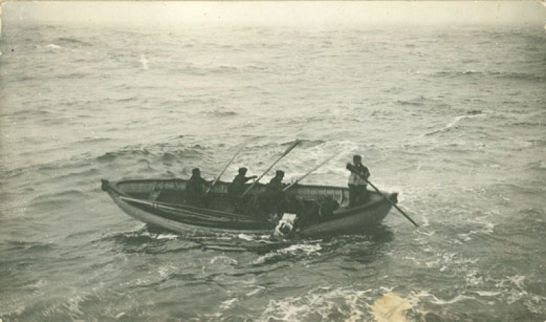 : A boat crew from the Cable Ship Minia picks up one of the Titanic victims. Recovery was hard, grim work, amidst large waves and dangerous ice floes. Crews were paid double and given extra rum rations.