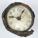 Clock found in explosion wreckage, front.
