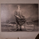 a black and white image of Karl Creelman and his bicycle.