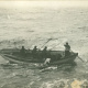 : A boat crew from the Cable Ship Minia picks up one of the Titanic victims. Recovery was hard, grim work, amidst large waves and dangerous ice floes. Crews were paid double and given extra rum rations.